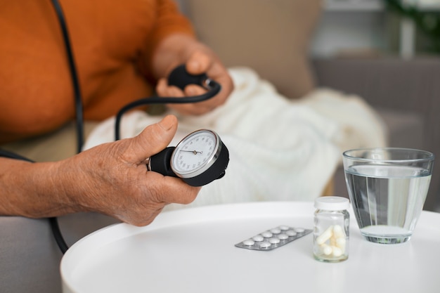 Older person checking their blood pressure with tensiometer