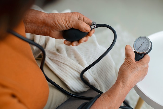 Older person checking their blood pressure with tensiometer