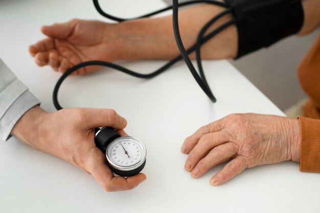 Older person checking their blood pressure with tensiometer