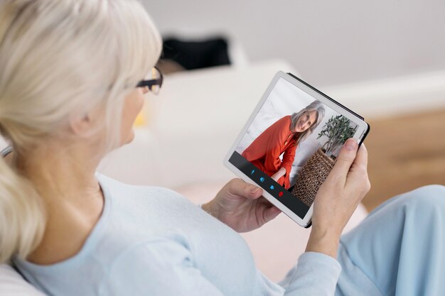 Older person using the video call feature on their device