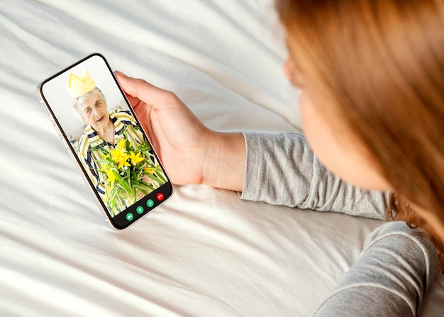 Older person using the video call feature on their device