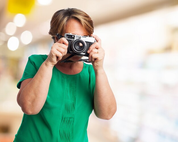 Older woman taking a picture