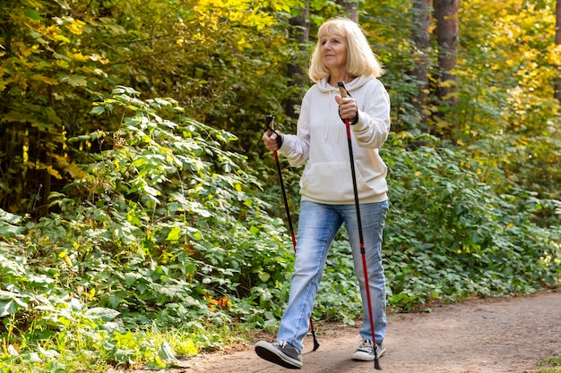 Older woman trekking outdoors
