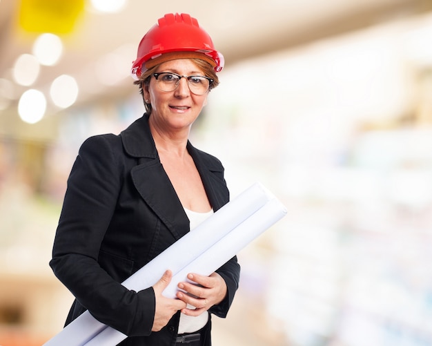 Older woman with blueprints