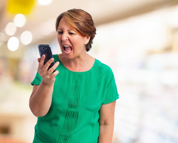 Older woman yelling at her phone