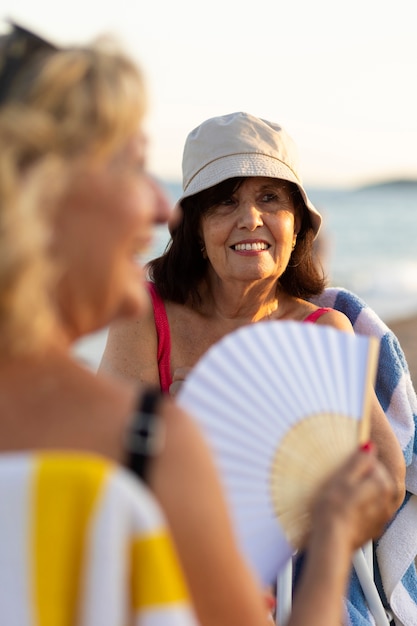 Free photo oldies having fun at the beach