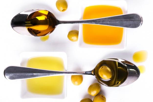 Olive oil in bowl and spoons