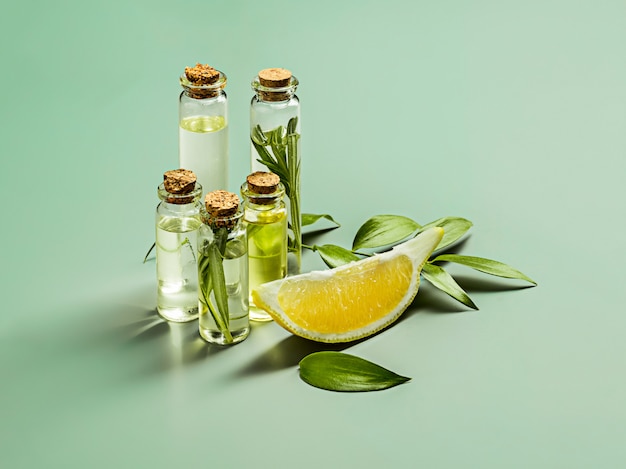 Olive oil and olive branch on the wooden table