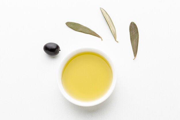 Olive oil saucer with leaves and black olive