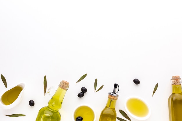 Olive oil saucers and bottles with copy space