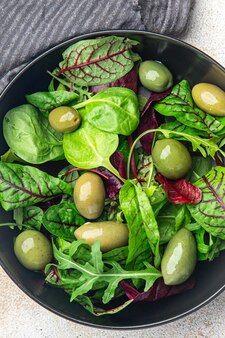 Olives green salad fresh portion dietary healthy meal food diet still life snack on the table