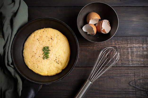 omelet in a pan onwood. 