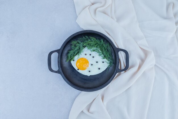 Omelet with pepper on dark pan