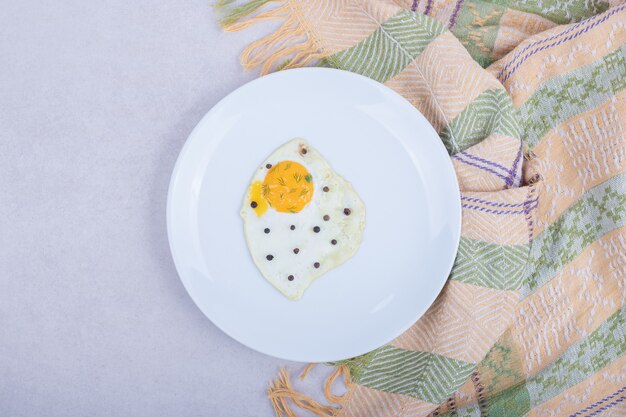 Free photo omelet with pepper on white plate .