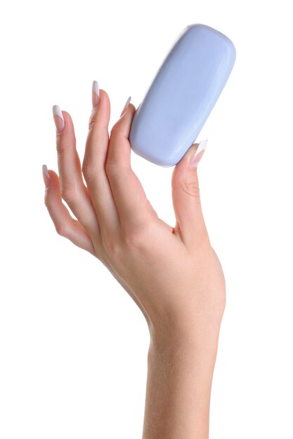 1つの美容女性の手が石鹸を保持