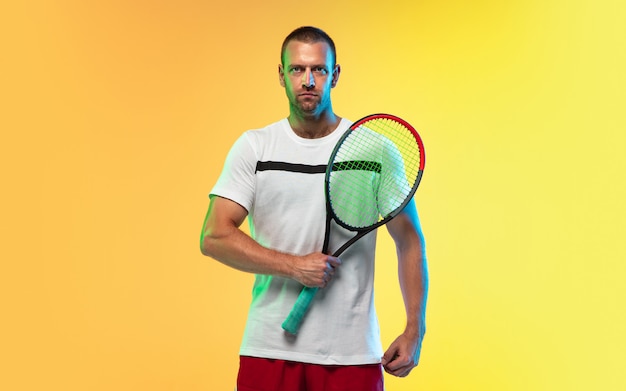 Free photo one caucasian man playing tennis isolated on studio