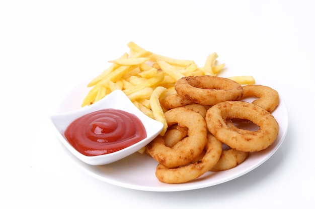 Onion rings and fries on plate