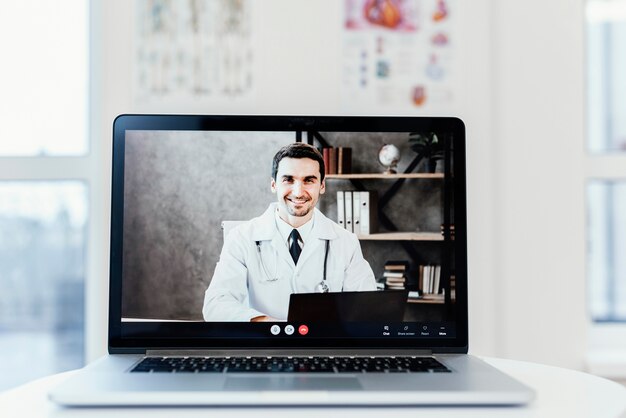 Online consultation with laptop on desk