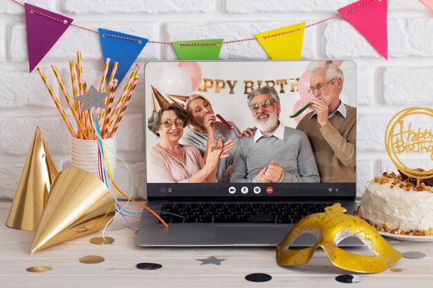 Online party celebration with laptop and decorations