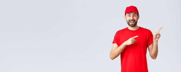 Free photo online shopping delivery during quarantine and takeaway concept enthusiastic smiling courier in red