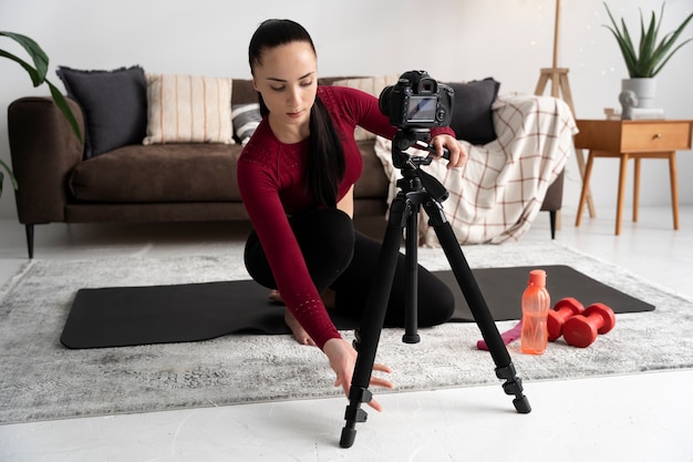 Online sport fitness instructor recording her session