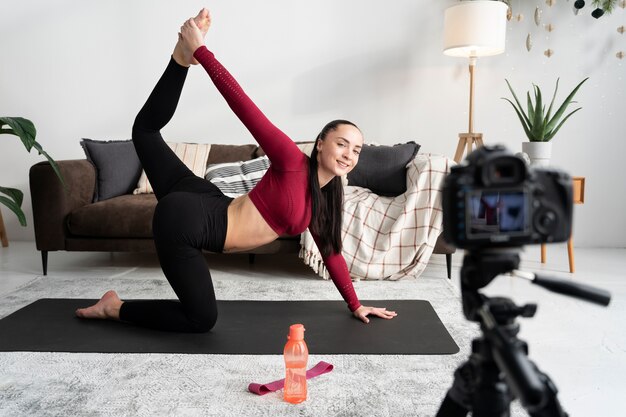 Online sport fitness instructor recording her session