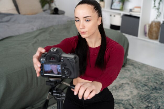 Online sport fitness instructor recording her session