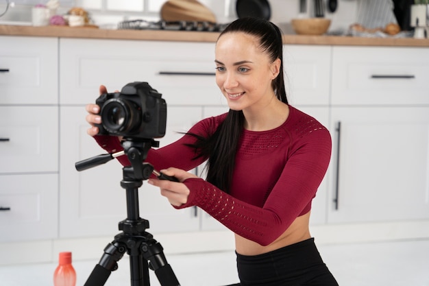 Online sport fitness instructor recording her session