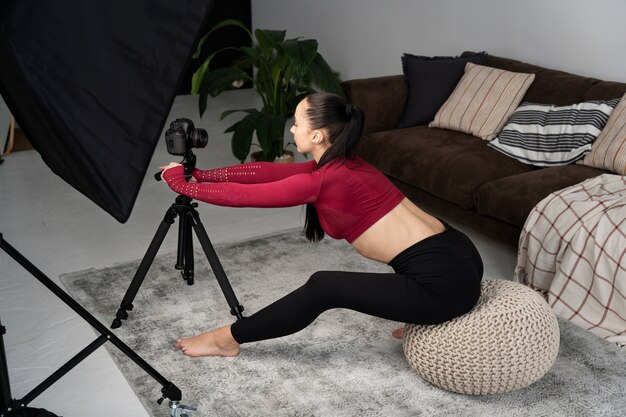 Online sport fitness instructor recording her session
