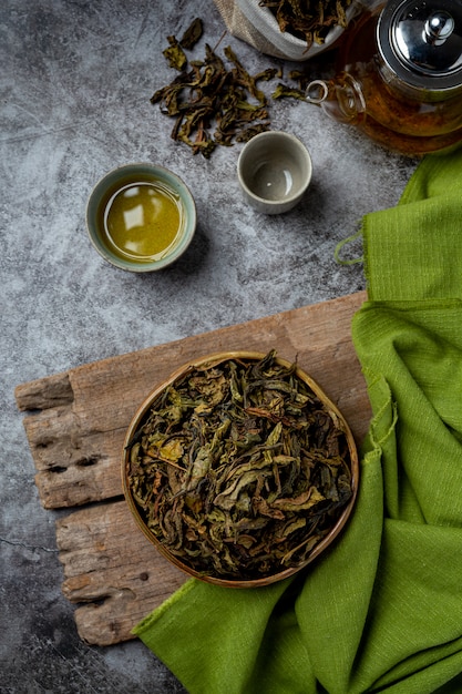 Oolong green tea in a teapot and bowl.