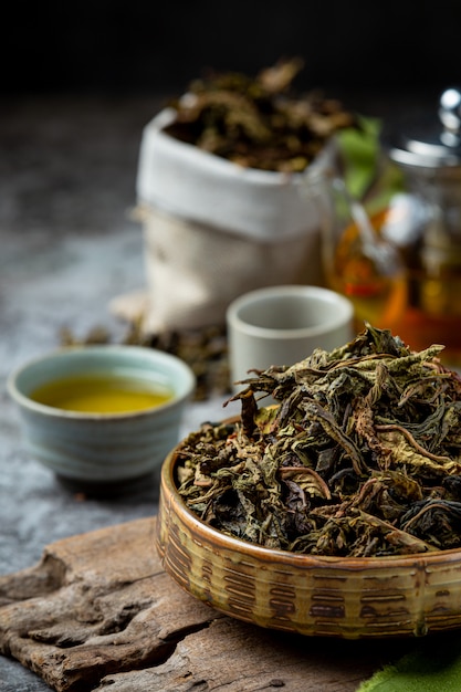 Oolong green tea in a teapot and bowl.