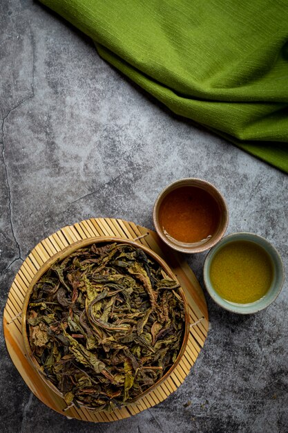 Oolong green tea in a teapot and bowl.