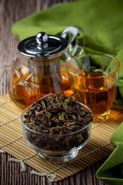 Oolong green tea in a teapot and bowl.