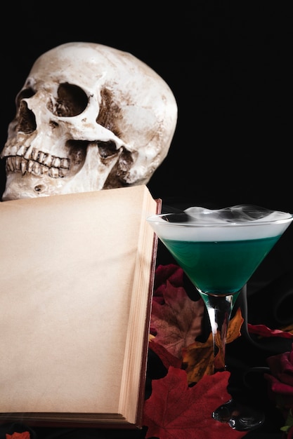 Open book with skull and drink