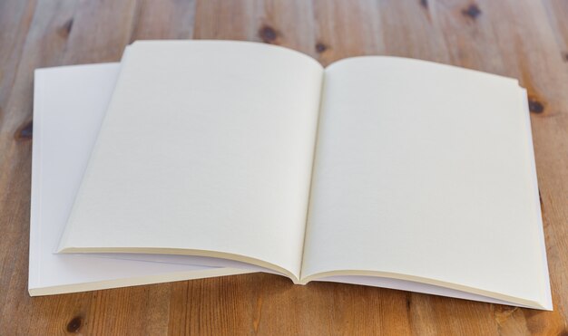 Open book on wooden table