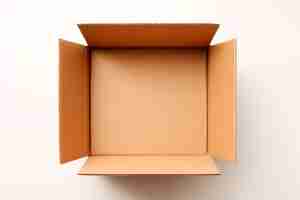 Free photo open cardboard bok view from top over blank white background