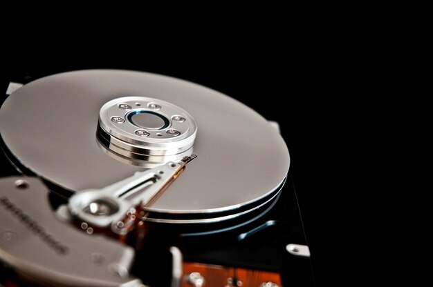 Open hard disk on a black background