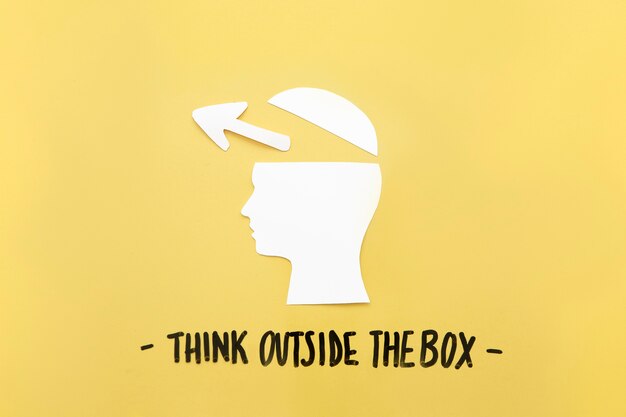 Open human brain with arrow symbol near think outside the box message