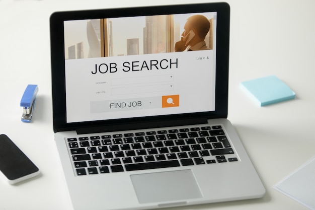 Free photo open laptop on the desk, job search title on screen