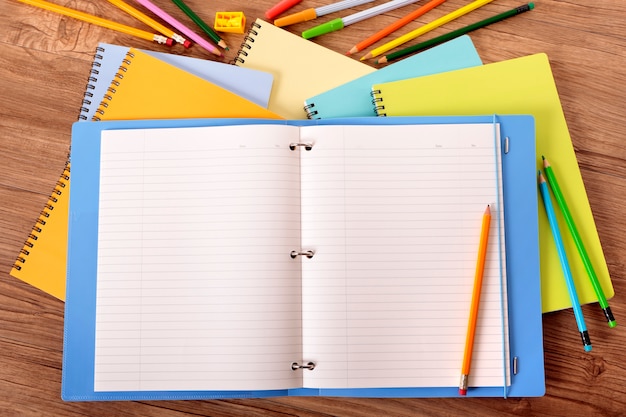 Free photo open notebook with color pencils