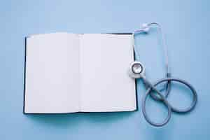 Free photo open notebook with stethoscope