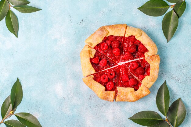 Open pie, raspberry galette. Summer berry dessert.