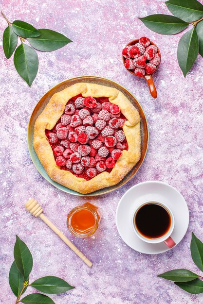 Open pie, raspberry galette. Summer berry dessert.