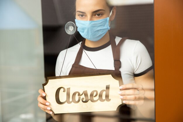 Open sign on the glass of street cafe or restaurant