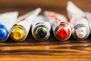 Free photo open tubes of paint