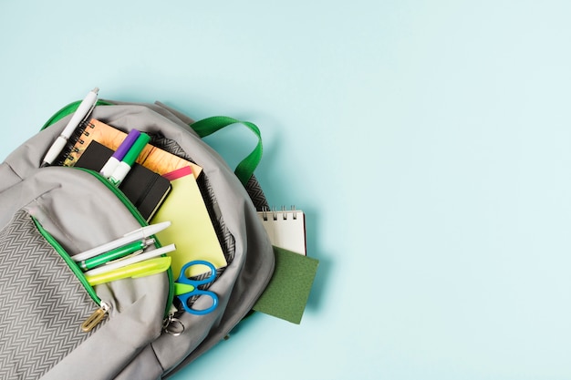 Opened backpack with school supplies