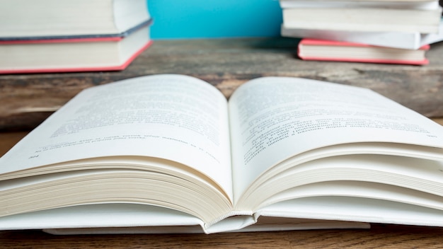 Opened book on wooden tabletop