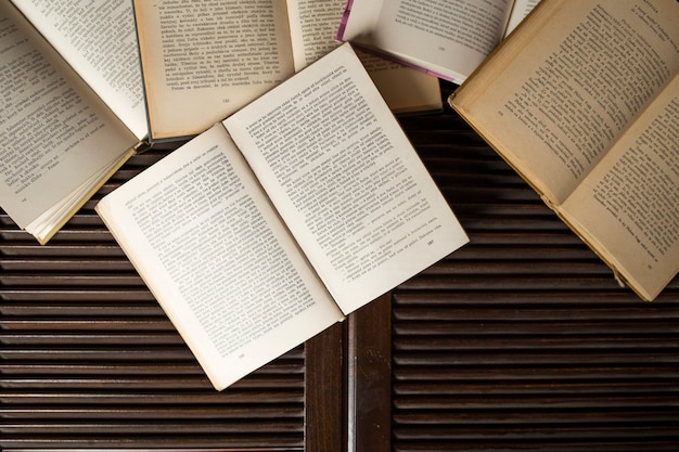 Opened books on library table