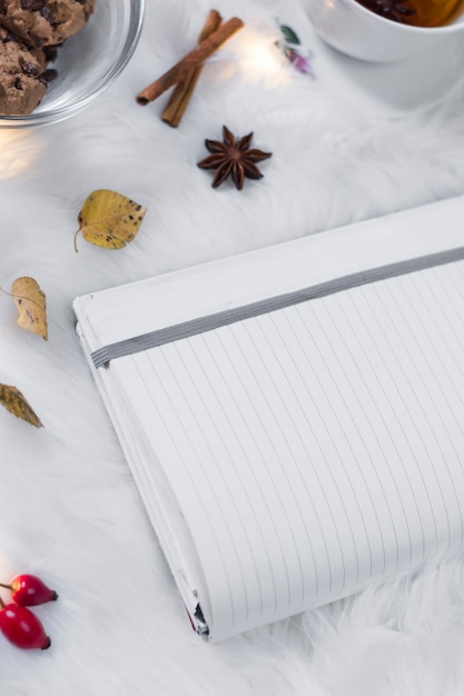 Opened notebook on white cover with decorations