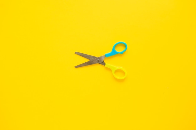 Opened scissors laid in middle